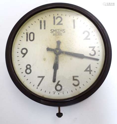 A mid 20thC Bakelite wall clock made by Smiths.