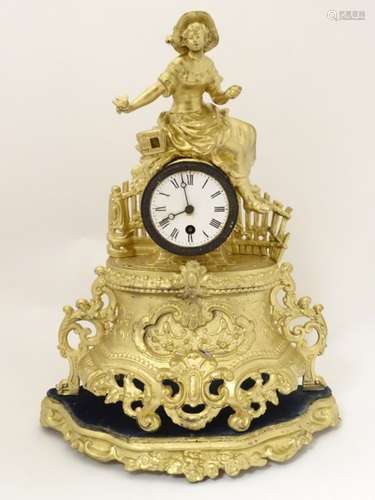 French gilt painted spelter mantel clock: a circular 30 hour timepiece movement in a case having an