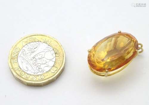 A gold pendant set with facet cut citrine 1