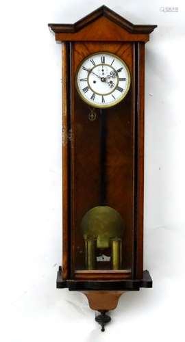 An early 20thC walnut Vienna regulator style wall clock,