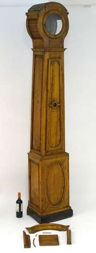 A continental 19thC cherry wood longcase clock (case only), with lenticel glass and a long door,