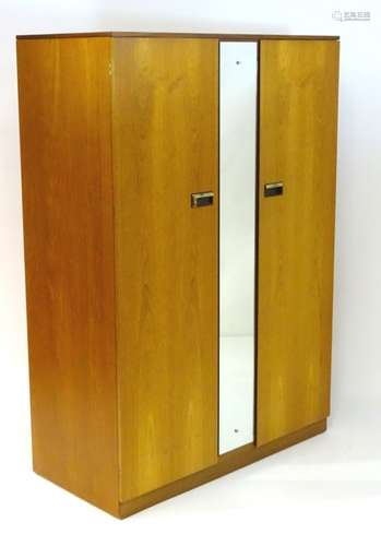 Vintage Retro: a British Limelight mid century 2 door wardrobe with mirror to central section,