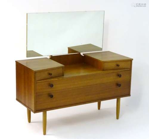 Vintage Retro: A British Avalon teak dressing table with angled top drawers and two long drawers on