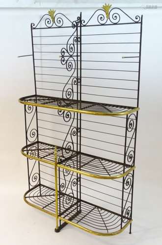 An early 20thC patisserie / bakers display stand of wrought iron and brass construction,