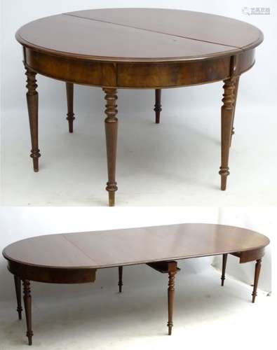 A Victorian mahogany 6-legged extending dining table with a figured frieze,