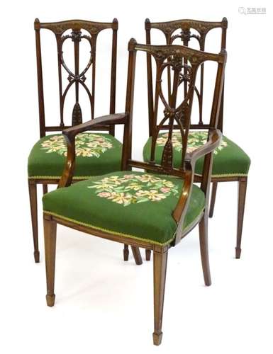 A set of three mahogany neoclassical dining chairs (2+1) produced by ‘Waring and Gillow’,