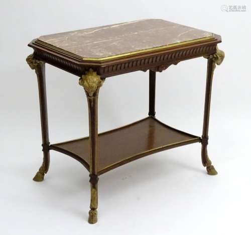 A 19thC marble top table with gilt brass surround,