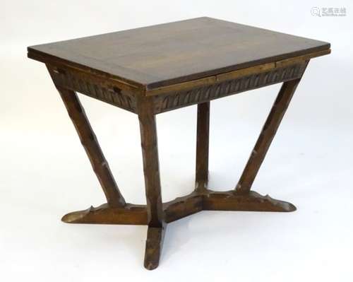 An early / mid 20thC oak draw leaf table designed by Arthur Romney Green,