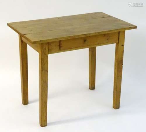 A late 19thC chestnut side table / writing table with a three plank top above a single frieze