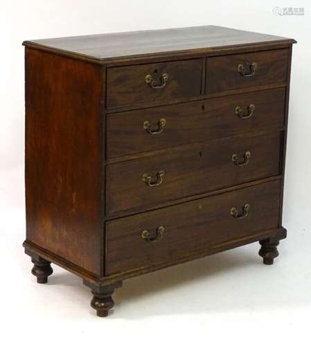 A Victorian mahogany chest of drawers with a rectangular moulded top above two short drawers and