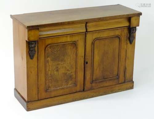 A mid / late 19thC mahogany chiffonier with a rectangular top above two short cushion drawers and