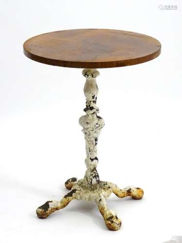 Pub table : a Victorian cast iron pedestal table, the base with remains of painted finish,