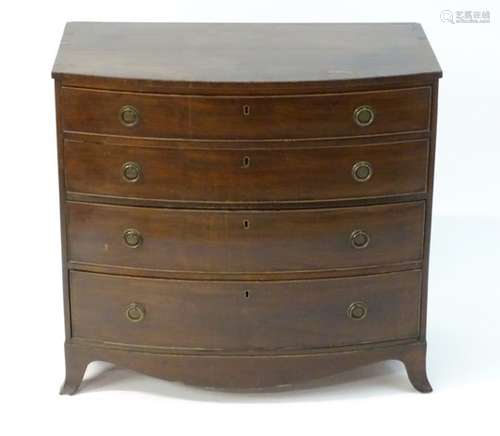 A mid 19thC mahogany bow fronted chest of drawers comprising four long graduated drawers,