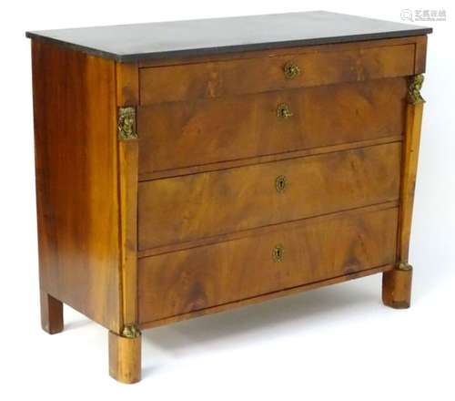 A late 19thC mahogany empire style chest of drawers,