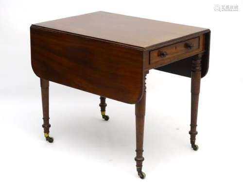 A mid 19thC mahogany Pembroke table with single long drawer, standing on ring turned tapering legs,