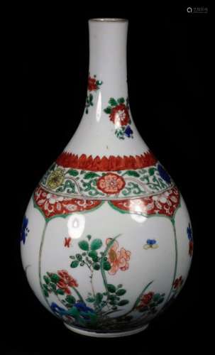 A 19thC Chinese famille vert porcelain bottle vase, decorated with panels of flowers and shrubs