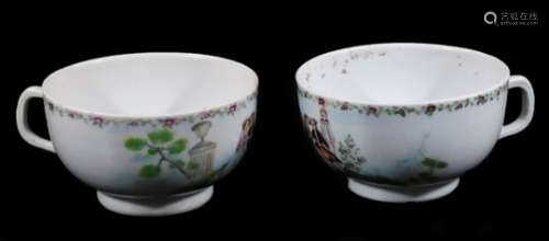 A pair of Chinese porcelain tea cups, decorated with European figures and a priest within a