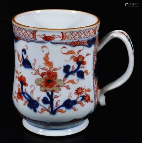 A large Chinese porcelain Imari pattern baluster tankard, decorated with a peony within a cell and