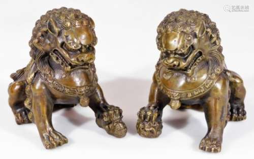 A pair of 20thC classical mystical dog of fo figures, standing on four paws, 15cm H. (2)