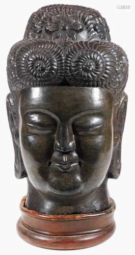 A large 20thC bronzed Chinese head sculpture, the figure with elaborate head dress and enlarged