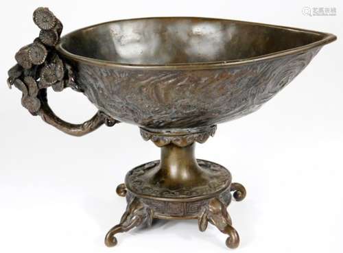 A Chinese patinated bronze vessel, with ellipse shaped bowl raised with geometric and floral