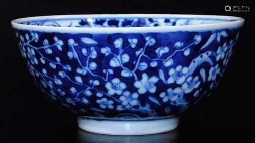 A Chinese porcelain prunus bowl, of circular form, profusely decorated to the exterior with