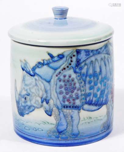 A Dennis China Works rhinoceros pot and cover, decorated with rhinoceros in blue, puce marked Dennis