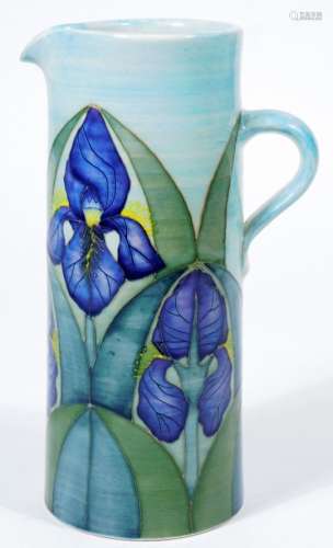 A Dennis China Works iris jug, decorated with blue irises, marked Dennis China Works R Mc 97 no.11