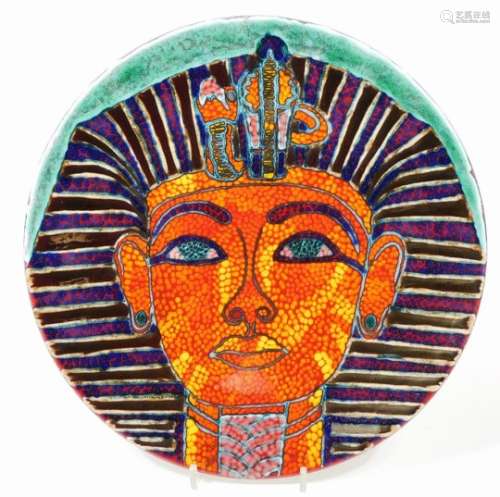 A Poole pottery Tutankhamun charger, decorated in a vivid palette with the image of the Boy King,