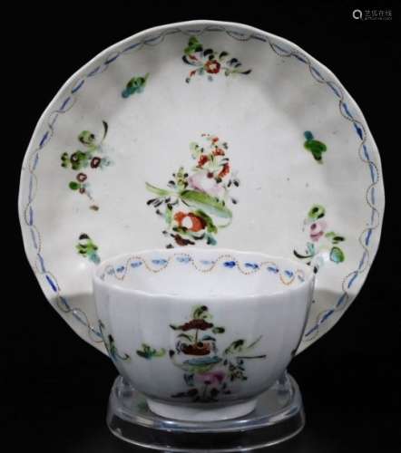 A late 18thC Pinxton porcelain tea bowl and saucer, fluted and decorated in an unrecorded pattern