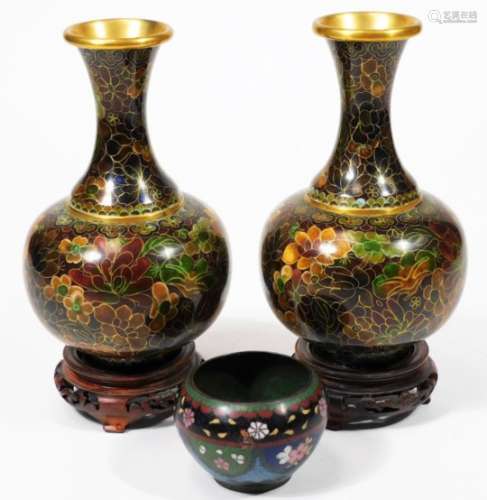 A pair of 20thC Chinese cloisonné vases, each of bulbous form with inverted trumpet stems, profusely