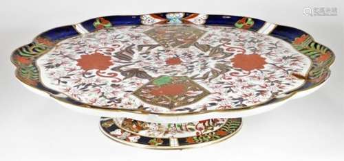 A 19thC English porcelain Imari comport, of large proportion, the floral top profusely decorated