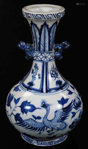 An Oriental porcelain blue and white vase, the inverted trumpet stem raised above a bellied circular