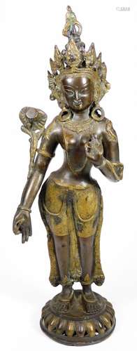 A classical bronze and gilt metal figure, possibly Guan Yin, in elaborate dress on a pierced domed