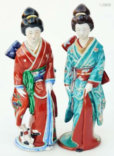 A Japanese pottery late Meiji figure, of a geisha in flowing robes florally decorated