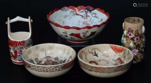 A Japanese late Meiji period pottery bowl, of circular form, profusely decorated with figures in