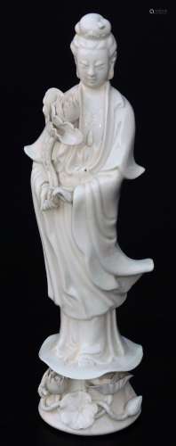 A Chinese semi porcelain blanc de chine figure, of a lady in flowing robes holding entwined