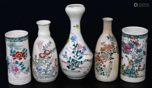 Various Japanese Meiji period pottery vases, each polychrome decorated, to include a double