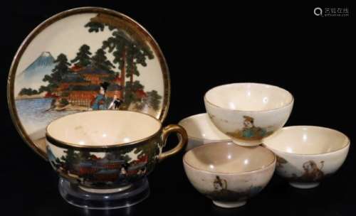 An early 20thC Japanese late Meiji period pottery Satsuma tea cup and saucer, decorated with figures