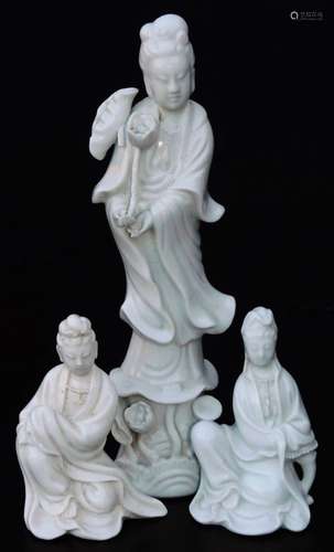 A Chinese porcelain blanc de chine figure, of a lady holding entwined flower in flowing robes, on