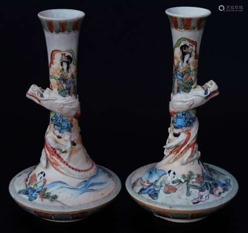 A pair of 19thC Japanese Meiji period pottery vases, each with cylindrical stems with entwined