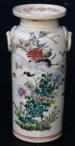 A Japanese pottery Kyoto type pottery vase, of turned form with moulded handles, the main body