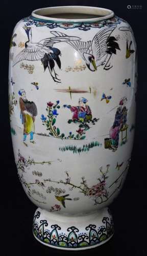 A Japanese Meiji period Kyoto type pottery vase, the shaped body decorated with crane, figures and