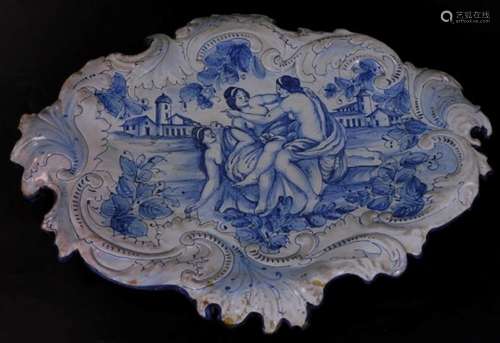 An Italian style Maiolica type tin glazed earthenware dish, of shaped oval form, decorated with