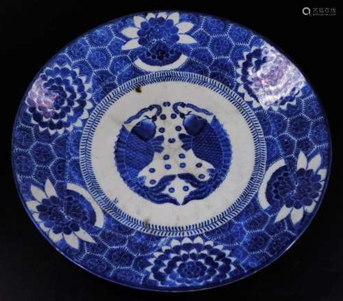 A Japanese porcelain Meiji style charger, of circular form, decorated with two fish to the centre