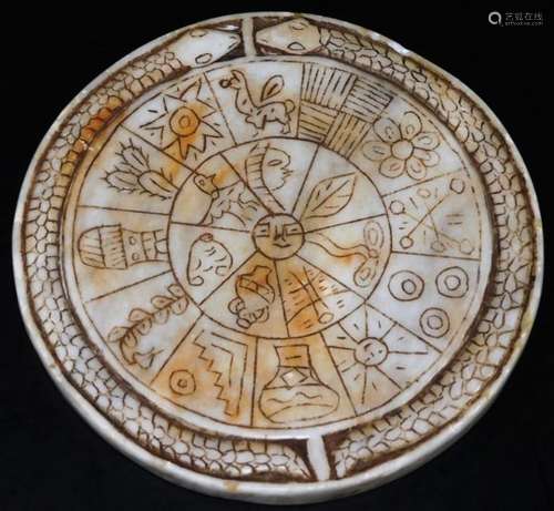 A South American calendar marble Zodiac disc, set with various features, vases, sun, etc. with an