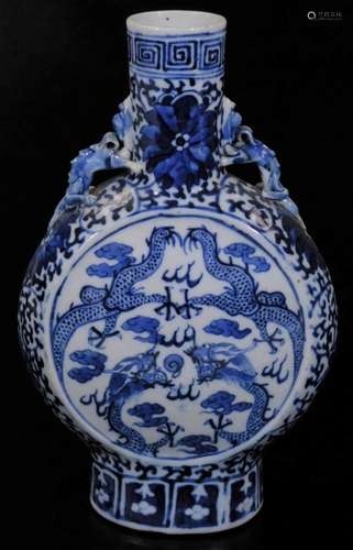 A 19thC Chinese blue and white porcelain moon flask, the circular body with dragon handles on oval