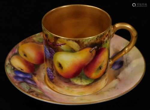 A 20thC Royal Worcester porcelain cabinet cup and saucer, 1925, by Reginald Austin, handpainted with