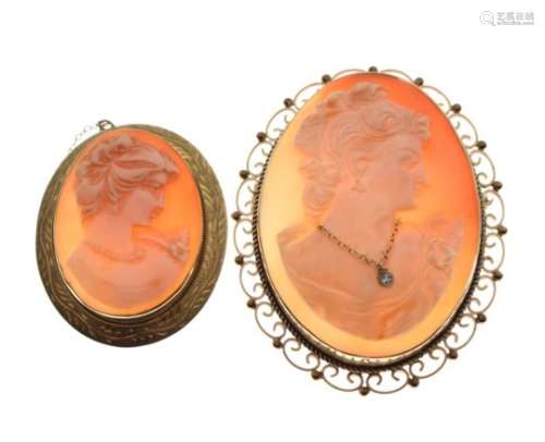 Two 9ct gold shell cameo brooches, the larger with small diamond pendant within scroll surround,