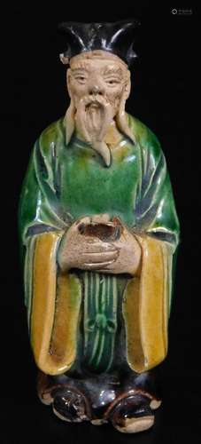 A Ming style terracotta grave figure of a warrior, dressed in finery, predominately in green, yellow